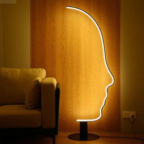 Artistic Black Face-Shaped Linear Metal Floor Lamp Image - 1