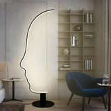 Artistic Black Face-Shaped Linear Metal Floor Lamp Image - 3