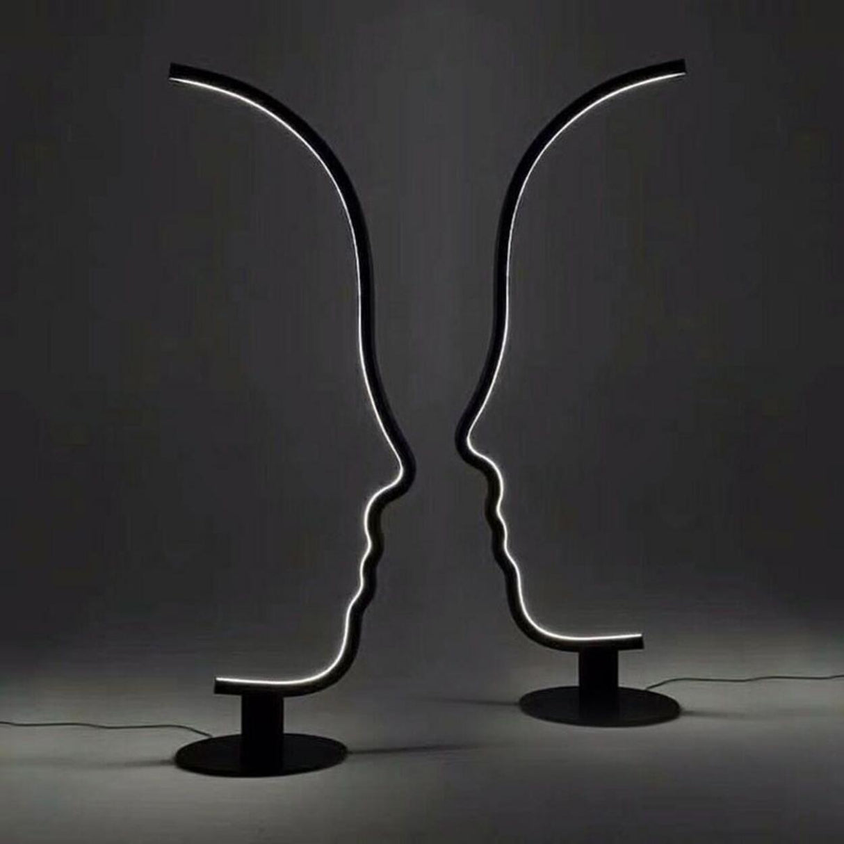 Artistic Black Face-Shaped Linear Metal Floor Lamp Image - 9