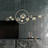 Artistic Black Globe and Ring Island Pendant Light Image - 1