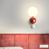 Artistic Red and White Globe Bedroom Wall Sconce Image - 1