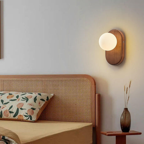 Bedroom Wood Base and White Globe LED Wall Sconce Image - 2