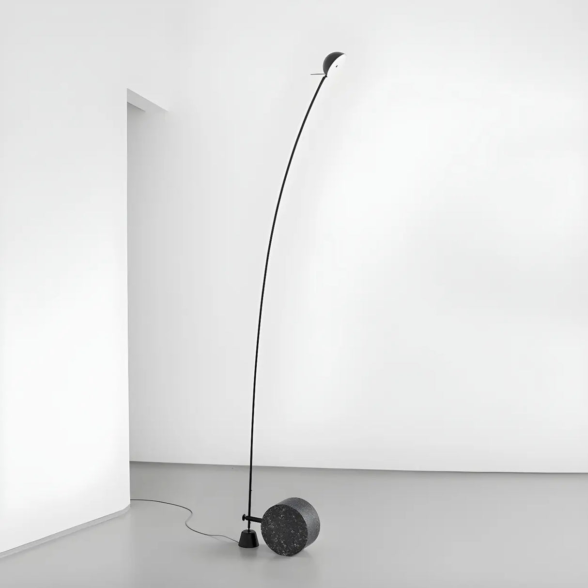 Black Minimalist Weighted Base Arched Floor Lamp Image - 1