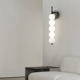 Contemporary Black Vertical Globe Wall Sconce Image - 1