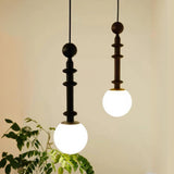 Contemporary Sculpted Black and White Globe Pendant Light Image - 1