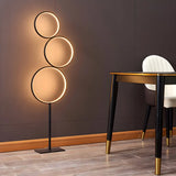 Creative Black Multi-Ring Metal and Silica Gel Floor Lamp Image - 1