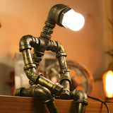 Creative Industrial Robot Warm Light Bronze Table Lamp Image - 8