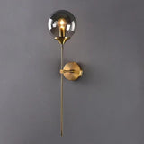 Elegant Brass and Glass Globe Wall Sconce Image - 1