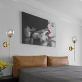 Elegant Brass and Glass Globe Wall Sconce Image - 2