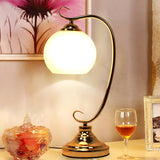 Elegant Dome Glass Shade Curved Metal Arm Table Lamp Image - 1