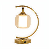 Elegant Golden Curved Clear Glass Shade Table Lamp Image - 5