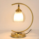 Elegant Golden Curved Clear Glass Shade Table Lamp Image - 6