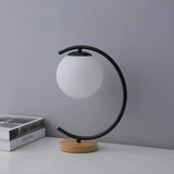 Elegant Simple Glass Globe Curved Metal Table Lamp Image - 10