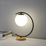 Elegant Simple Glass Globe Curved Metal Table Lamp Image - 9