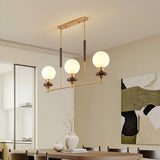 Gold and Wood Globe Pendant Light Kitchen Island Image - 1