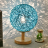 Hand-Woven Rattan Global Shade Wooden Base Table Lamp Image - 4