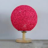 Hand-Woven Rattan Global Shade Wooden Base Table Lamp Image - 7