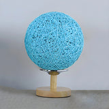 Hand-Woven Rattan Global Shade Wooden Base Table Lamp Image - 8