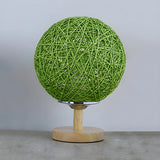 Hand-Woven Rattan Global Shade Wooden Base Table Lamp Image - 9