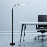 Minimalist Black Arced Linear Metal LED Floor Lamp Image - 3