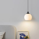 Minimalist Black Metal White Glass Globe Pendant Light Image - 1