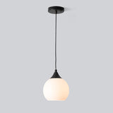 Minimalist Black Metal White Glass Globe Pendant Light Image - 5