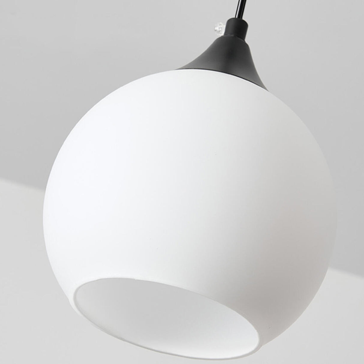 Minimalist Black Metal White Glass Globe Pendant Light Image - 7