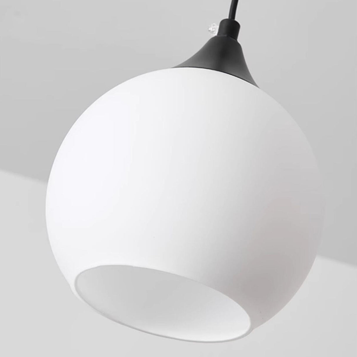 Minimalist Black Metal White Glass Globe Pendant Light Image - 8