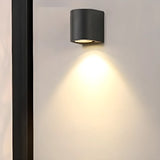 Minimalist Black Outdoor Up Down Wall Sconce Image - 1