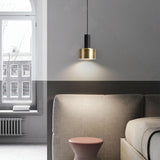 Minimalist Brass and Black Metal Cylinder Pendant Light Image - 1