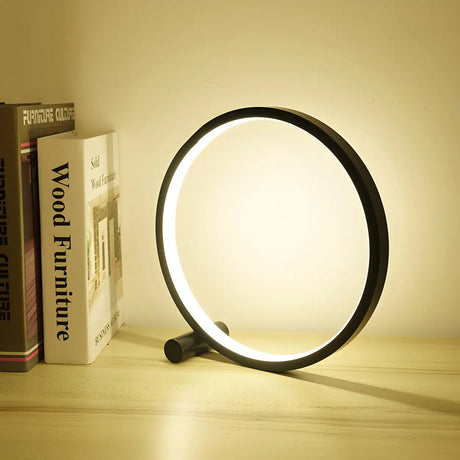 Minimalist Circular Metal Black Ambient Table Lamp Image - 1