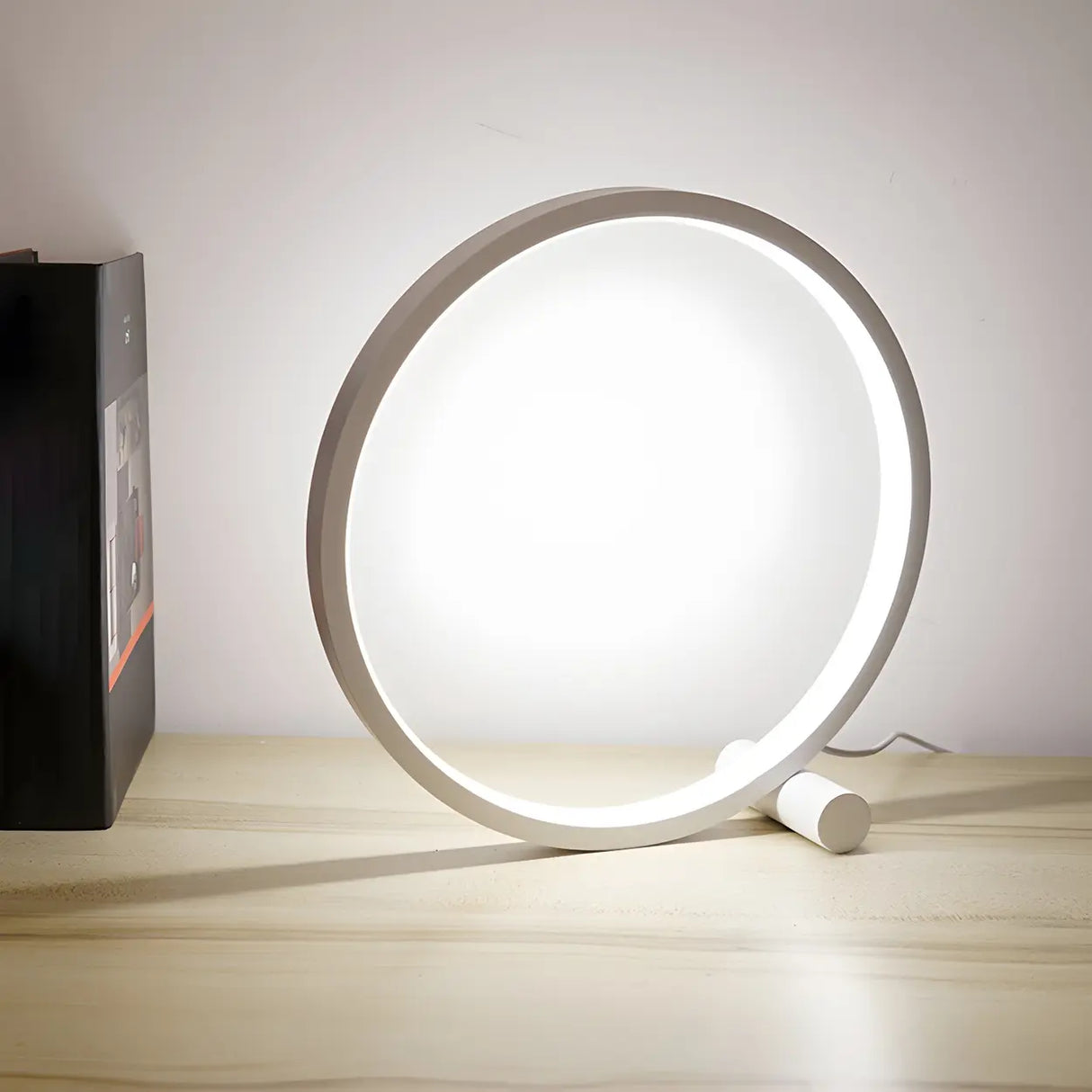 Minimalist Circular Metal Black Ambient Table Lamp Image - 3