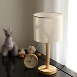 Minimalist Fabric Shade Wood Base Cylinder Table Lamp Image - 12