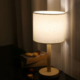 Minimalist Fabric Shade Wood Base Cylinder Table Lamp Image - 3