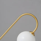 Minimalist Glass Globe Shade Curved Brass Table Lamp Image - 10