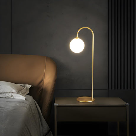 Minimalist Glass Globe Shade Curved Brass Table Lamp Image - 2