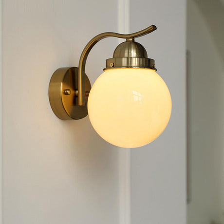 Minimalist Globe Glass Shade Brass Metal Wall Sconce Image - 1