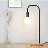 Minimalist Globe Shade Wood Base Black Metal Table Lamp Image - 1