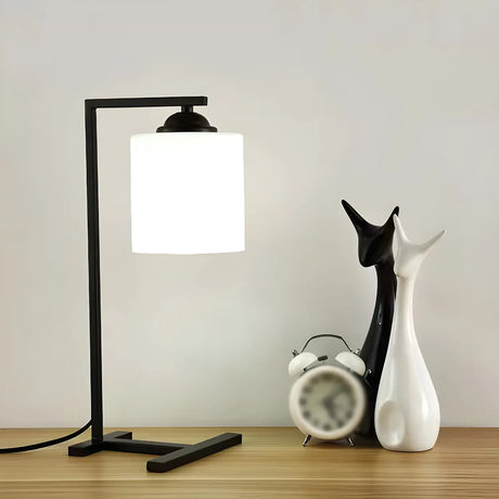 Minimalist White Cylinder Shade Black Base Table Lamp Image - 2