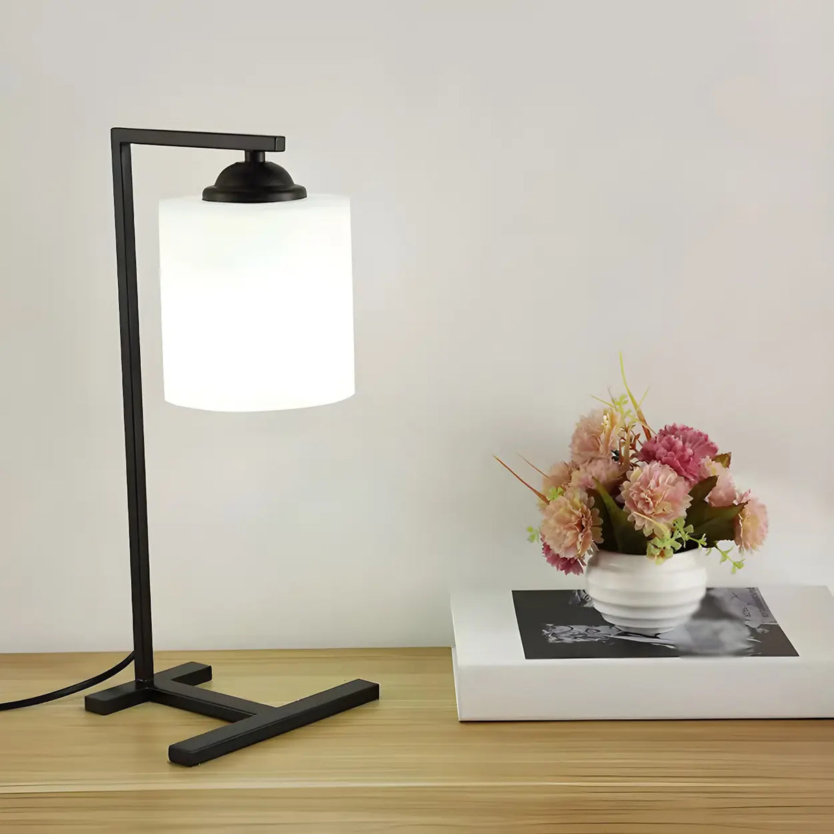 Minimalist White Cylinder Shade Black Base Table Lamp Image - 3