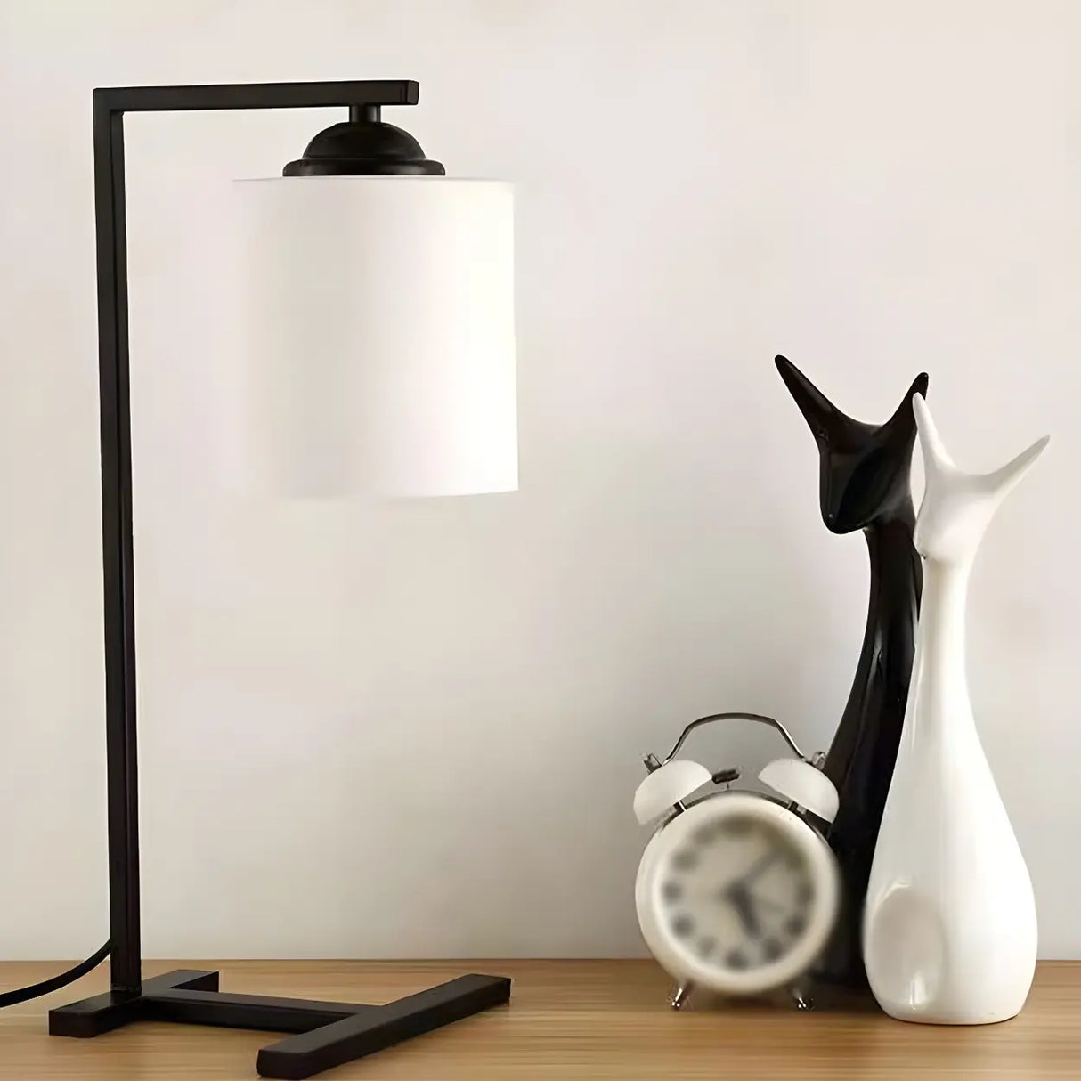 Minimalist White Cylinder Shade Black Base Table Lamp Image - 4