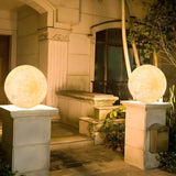 Minimalist White Globe Outdoor Stone Garden Table Lamp Image - 1