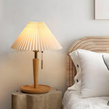 Minimalist White Pleated Shade Wooden Base Table Lamp Image - 6