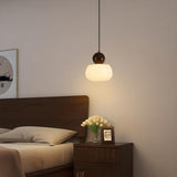 Minimalist Wood Accented Drum Bedroom Pendant Light Image - 4