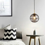 Modern Abstract Brass Clear Glass Globe Pendant Light Image - 3