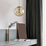 Modern Abstract Brass Clear Glass Globe Pendant Light Image - 4