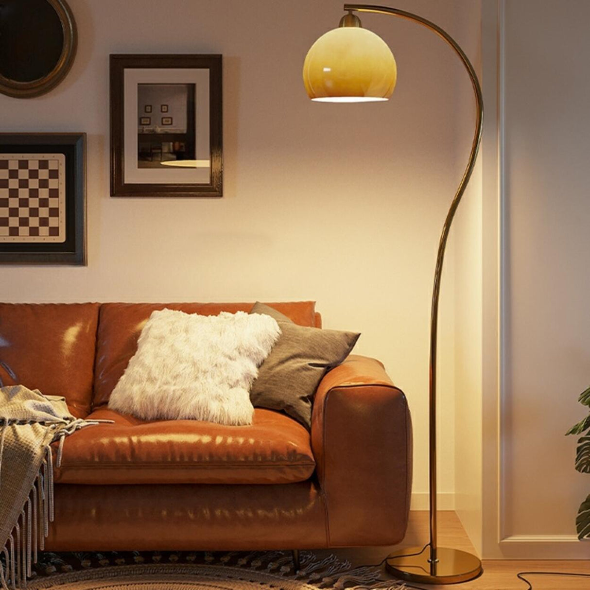 Modern Amber Dome and Curved Gold Metal Floor Lamp Image - 1