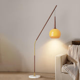 Modern Angled Amber Globe Walnut Metal Floor Lamp Image - 1