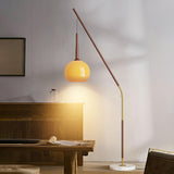 Modern Angled Amber Globe Walnut Metal Floor Lamp Image - 4