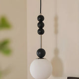 Modern Black Matte White Glass Globe Pendant Light Image - 5